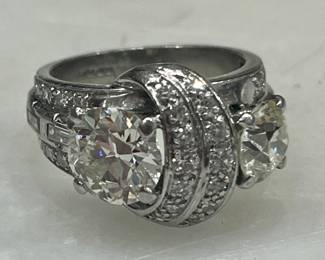 1920s platinum and European cut diamond ring…one stone is 1.2 carats and another stone is .97 carats.  Over 4 carats total weight.