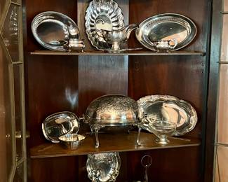 Dozens of sterling and plated service items