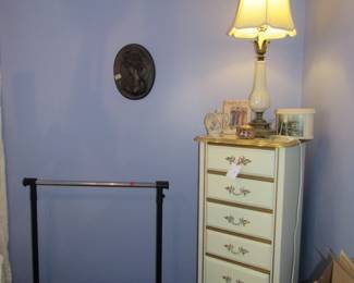 clothing rack, wall racks, lamp, lingerie chest