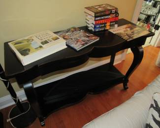 black sofa/foyer table, books