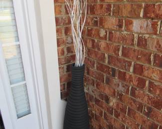 2 tall black vases with white sticks