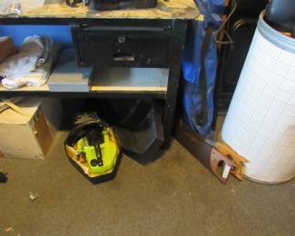 work bench, chain saw, hand saws