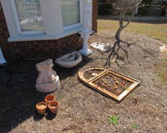 wall fountain, wall planter, cast iron statues on pillars