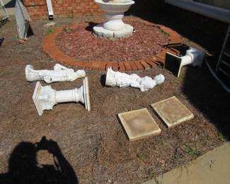 cast iron statues with pillar and stepping stone for base