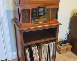 Modern radio,  record player,  on vintage table 