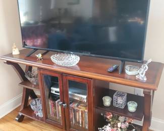 Pretty  TV table, and 50 inch Flat screen 