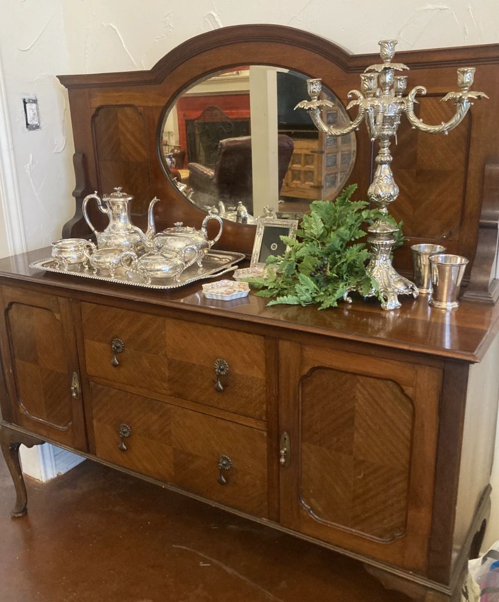 Mirrored antique buffet;  lovely silver tea service