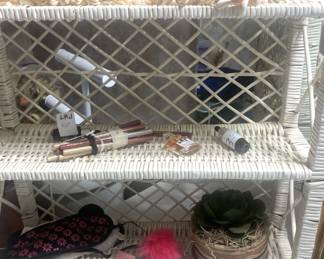 Small white wicker shelf