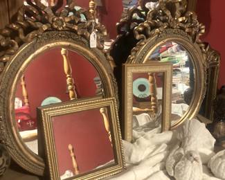 Matching oval mirrors; smaller mirrors