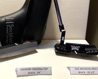 Two of the several putters - Seemore and PXG