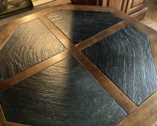 Wood, slate, and metal octagonal coffee table