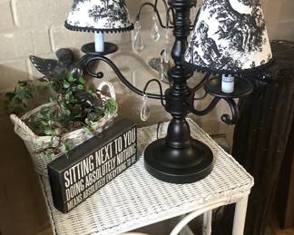 Small white wicker side table; toile fabric shades