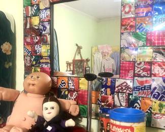 Small Radio Flyer wagon; drink can framed mirror