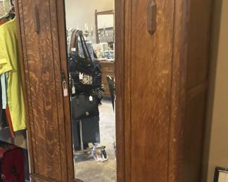 Antique armoire with mirrored door