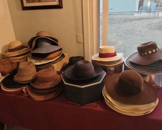 Assorted hats, some are designer
