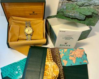 Rolex men’s watch authenticated and appraised. With box and papers. 
