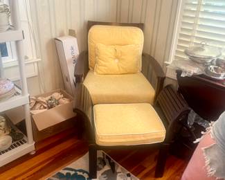 Armchair and ottoman. They have the same fabric and the furniture pieces coordinate, not match.