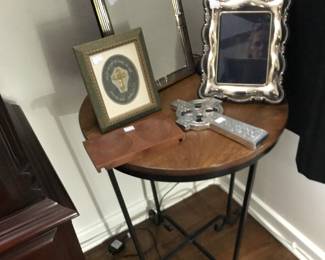 iron and wood round table, 75.00