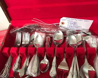 set of stainless silverware in box 50.00