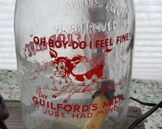 Large milk jar made into lamp