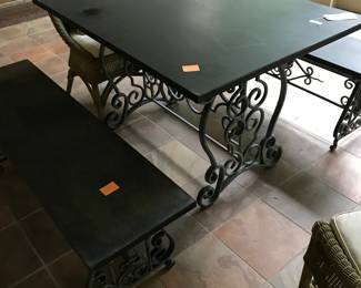 Cast metal picnic table with two benches