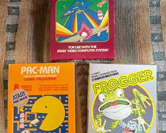Activision River Raid video game cartridge, $14.  Atari Pac-Man game, $14.  Atari Frogger,  $18