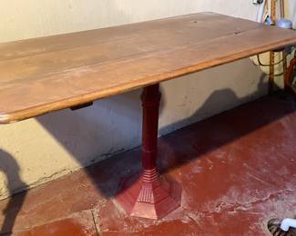 Wood top red cast iron base table, 44"W x 31"H x 24"D,  $65