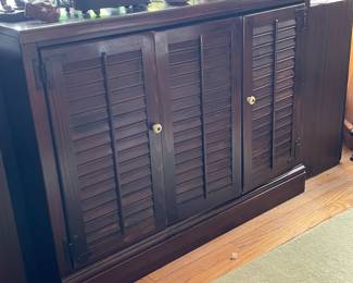 Dark wood 3 door shutter style cabinet,   $245