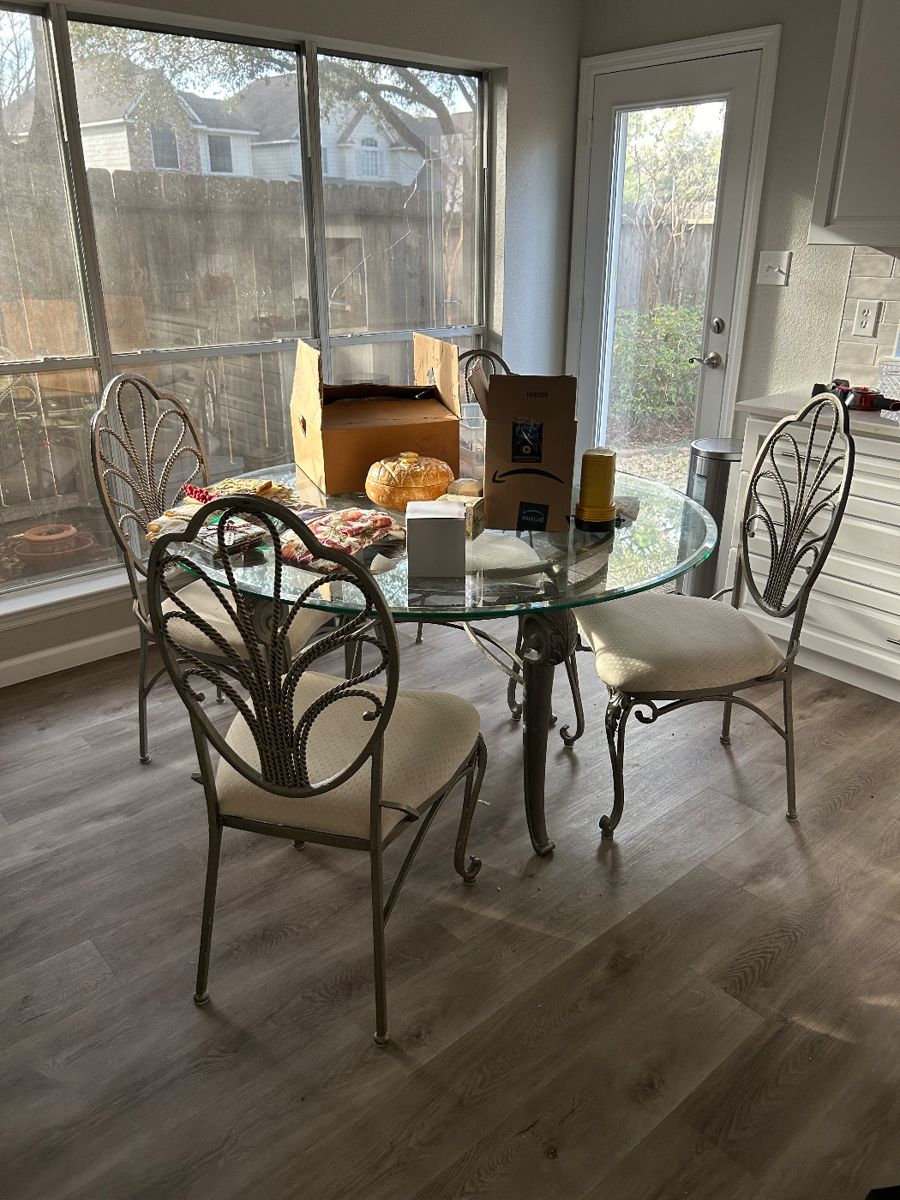 Glass round table with upholstered chairs