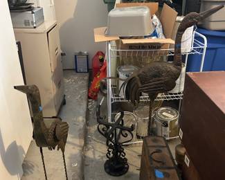 Metal bird statues, filing cabinet, paint, pet carriers, grill tools, storage cabinets