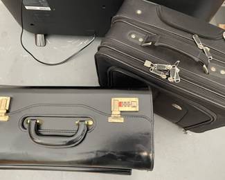 Two never used attache and overnight bags, one is leather with locks