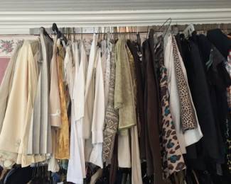 Overview of vintage clothing, mostly separates such as tops, crop jackets, blouses, sweaters, t-shirts