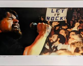 A photographic print of Bob Seger performing at the 1980 Cobo Hall concert in Detroit, Michigan. Limited edition of 50 prints from the original negatives taken by Andrew Sacks, fused to foam board. Signed "Andrew Sacks" and dated "1980" lower right, numbered "1/50" lower center and titled lower left. Image 21 1/4 x 11 3/4" high , foam board 24 x 16" high overall.