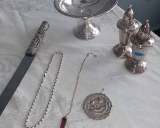 Sterling silver Weighted tazza 70
16 in Italian sterling silver ball chain 50
Japanese dragon pendent 45
Kiddush bread knife 925 Strerling Israel 125.00
Italian agate fist 45