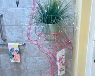 Pink wire covered Flamingo plant stand & towel holder in shower 