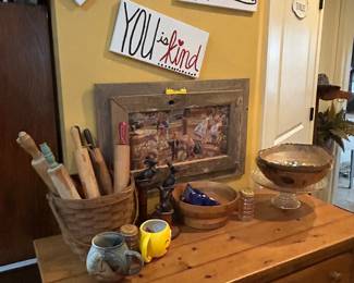 Vintage rolling pins, basket, metal mouse set, cups, cake plate, bowl with more marbles, round wood den bowl,double wood frame with picture, signs- all
On antique table with drawers 