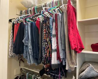 Lots of clothing in both bedroom closets - range from 12-16 or Medium to X-large 