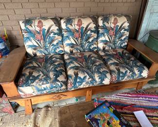 Cushioned wooden patio sofa 