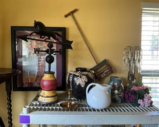 Black horse weather vane on pedestal, picture, vases, pitcher, Ball jars full of buttons, prism small lamp, vintage child’s push toy on wall