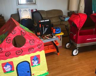Child's play tent, B&D toy tool bench, and heavy duty child's wagon with two sun shades.