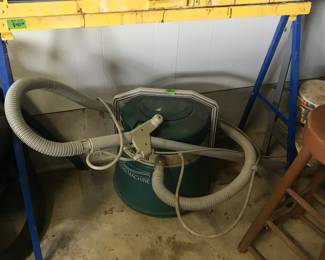 Pair of folding saw horses and an old canister vacuum cleaner, one of three!