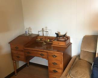 Typewriter desk; the top of the left side pushes up and a flat "drawer" that holds the (not supplied) typewriter pulls out. Well made from solid wood.