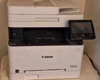 Canon color laser printer/scanner/ fax. Can use generic laser cartridges. Multiple page feeder, prints 2-sided documents