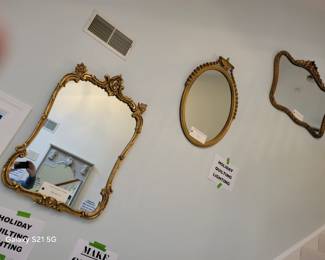 collection of gold framed and other mirrors 