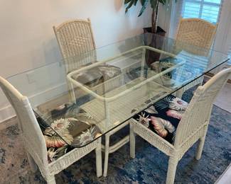 White Wicker Dinning set with Glass Top & 4 Chairs.         Table: 66"L 40"W 28"T     $ 300.00 set