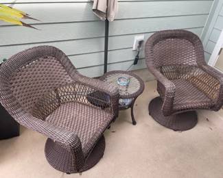 Resin Patio Set: (2) swivel & rock chairs, small round table, Umbrella and stand.