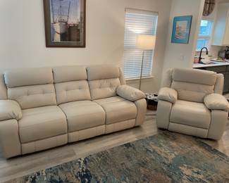 Havertys' Cream Leather adjustable (leg /neck) sofa and oversized chair. Electric with USB plugs.                                                          Sofa: 92" W 36" D 41" T    Chair: 45" W 36" D 41" T 