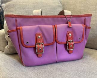 Coach purse. Colors are pink, orange, and purple with cream straps. Sun Fading on outside. 