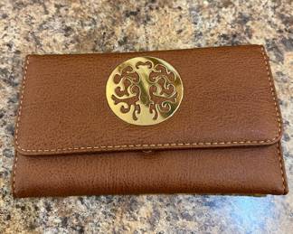 Brown wallet looks new. 