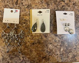Costume jewellery. Two dangle earrings and set of 3 stud earrings.